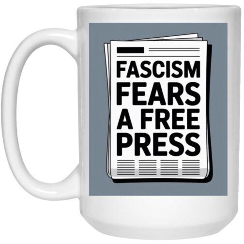 1032-9816-107796388 15oz ceramic coffee mug with "Fascism Fears A Free Press" newsprint design. A political mug supporting journalism and the First Amendment.