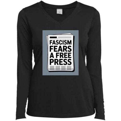 A black women's V-neck long sleeve tee featuring a newspaper graphic with the text "Fascism Fears A Free Press," reflecting the blog's activist apparel theme.