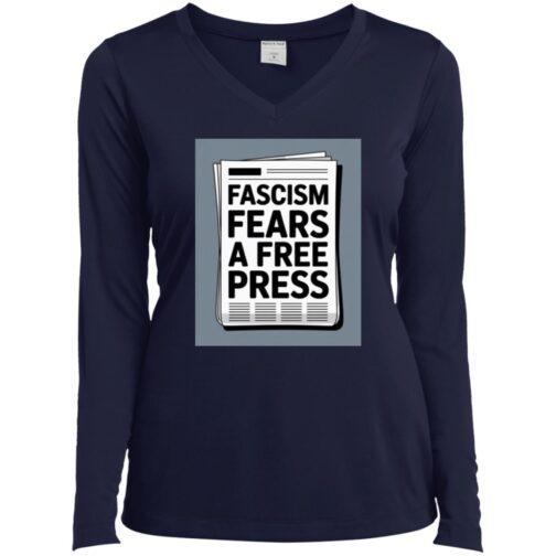 A navy blue women's long-sleeve v-neck tee shirt features a graphic of a newspaper with the text "Fascism Fears A Free Press." Activist apparel.