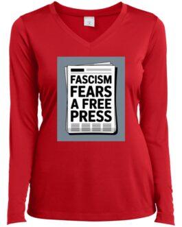 A red women's long-sleeve v-neck tee shirt features a newspaper graphic with the text "Fascism Fears A Free Press". Activist apparel promoting freedom of the press.