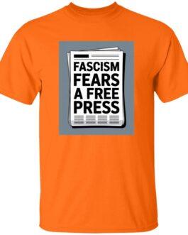 An orange t-shirt featuring a graphic of a newspaper with the bold text "Fascism Fears A Free Press," highlighting the importance of a free press. Activist apparel.