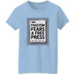 Light blue “Fascism Fears A Free Press” women's classic fit cotton tee featuring a newspaper graphic. Activist apparel supporting journalism and the First Amendment.
