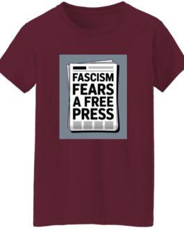 A maroon women's classic fit cotton tee with a square graphic of a newspaper. The text on the newspaper reads "Fascism Fears a Free Press," highlighting the activist t-shirt's theme.
