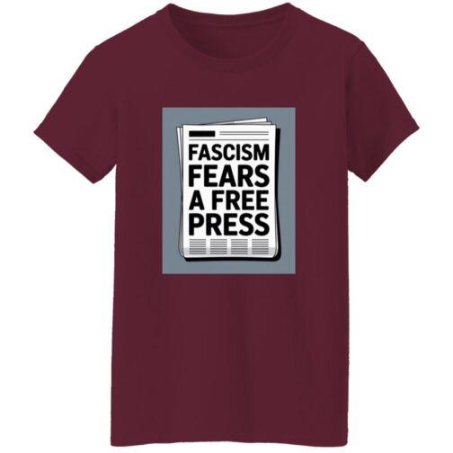 A maroon women's classic fit cotton tee with a square graphic of a newspaper. The text on the newspaper reads "Fascism Fears a Free Press," highlighting the activist t-shirt's theme.