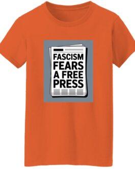 An orange women's classic fit cotton tee with a graphic of a newspaper headline that reads, "Fascism Fears A Free Press." This activist t-shirt promotes freedom of the press.