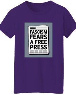 Purple t-shirt featuring a newspaper graphic with the text "Fascism Fears A Free Press." An activist t-shirt promoting freedom of the press.
