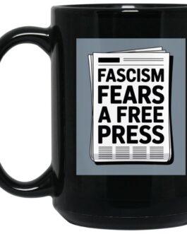 Black 15oz ceramic coffee mug with "Fascism Fears A Free Press" newspaper graphic. A political statement mug for activists and journalism supporters.