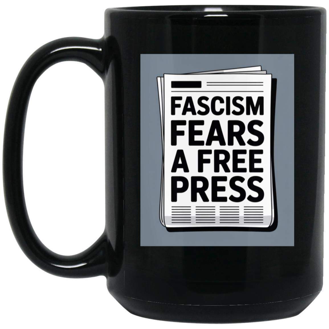 Black 15oz ceramic coffee mug with "Fascism Fears A Free Press" newspaper graphic. A political statement mug for activists and journalism supporters.