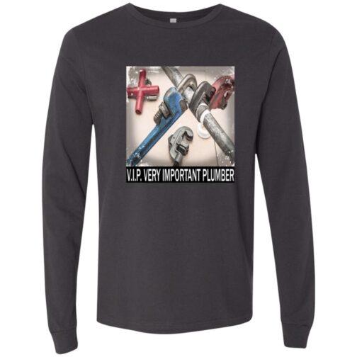 Dark grey long sleeve tee featuring a square graphic of crossed plumbing pipes and wrenches. The graphic includes the text "V.I.P. VERY IMPORTANT PLUMBER.