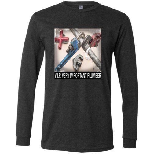 A dark grey heather long sleeve tee featuring an image of plumbing pipes being worked on with wrenches, and the text "V.I.P. Very Important Plumber".