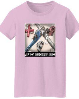 Light pink V.I.P. Very Important Plumber t-shirt. The shirt features a square graphic of plumbing pipes and tools, with "V.I.P. VERY IMPORTANT PLUMBER" printed below.