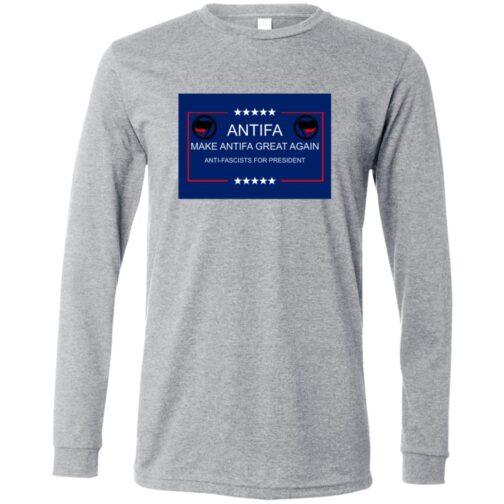 A heather gray long-sleeve shirt featuring a blue rectangle design with "ANTIFA MAKE ANTIFA GREAT AGAIN ANTI-FASCISTS FOR PRESIDENT" text, stars, and the Antifa flag symbol.
