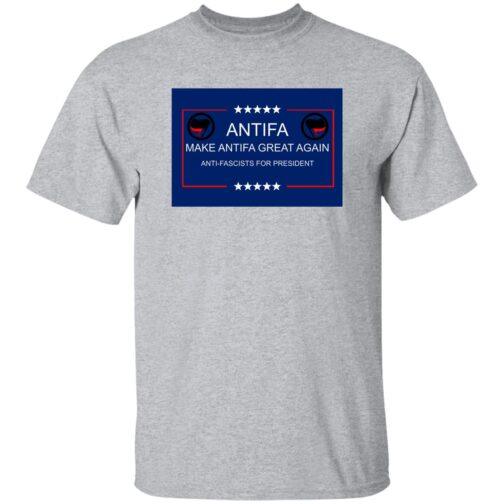 A sport grey t-shirt displays a blue graphic with "Antifa: Make Antifa Great Again" in white text. The design includes the Antifa flag symbols and stars. "Anti-Fascists for President" is also featured.