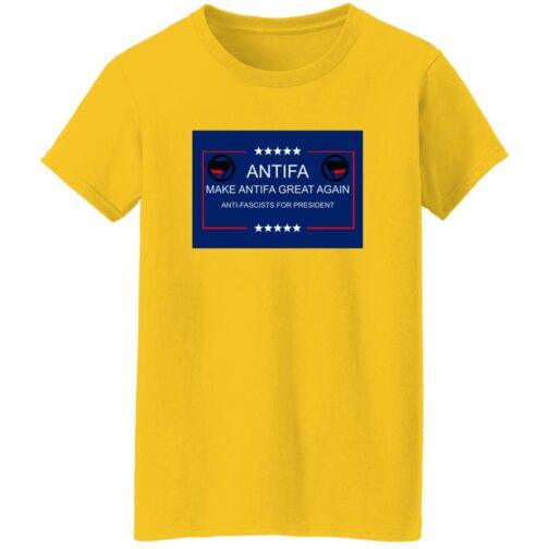 A yellow "Make Antifa Great Again" t-shirt with a blue and red design featuring "Antifa" text and crossed flags. The design promotes an anti-fascist message for president.
