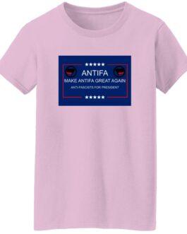 Light pink "Make Antifa Great Again" t-shirt. The design includes the Antifa symbol and text "Antifa" and "Anti-Fascists for President" within a blue rectangle with stars.