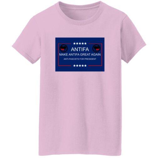 Light pink "Make Antifa Great Again" t-shirt. The design includes the Antifa symbol and text "Antifa" and "Anti-Fascists for President" within a blue rectangle with stars.