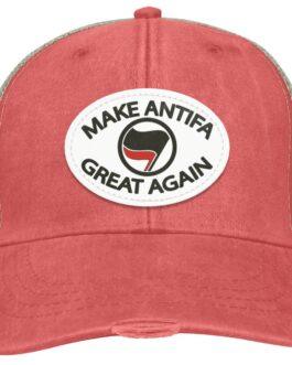 Coral "Make Antifa Great Again" hat. This Adams trucker cap features a vegan leather oval patch with "MAKE ANTIFA GREAT AGAIN" text and an Antifa flag symbol.