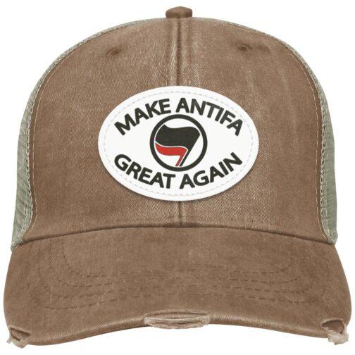 Distressed brown "Make Antifa Great Again" hat. This Adams trucker cap features a vegan leather patch with anti-fascist imagery, combining political statement with vintage style.