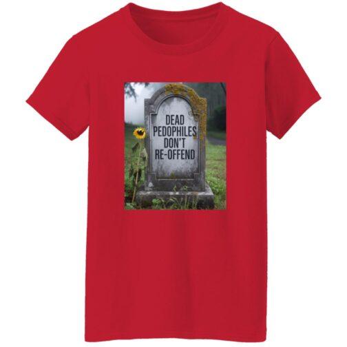A red women's graphic tee with a tombstone design featuring the text "Dead Pedophiles Don't Re-Offend". A sunflower stands beside the moss-covered tombstone in a graveyard setting.